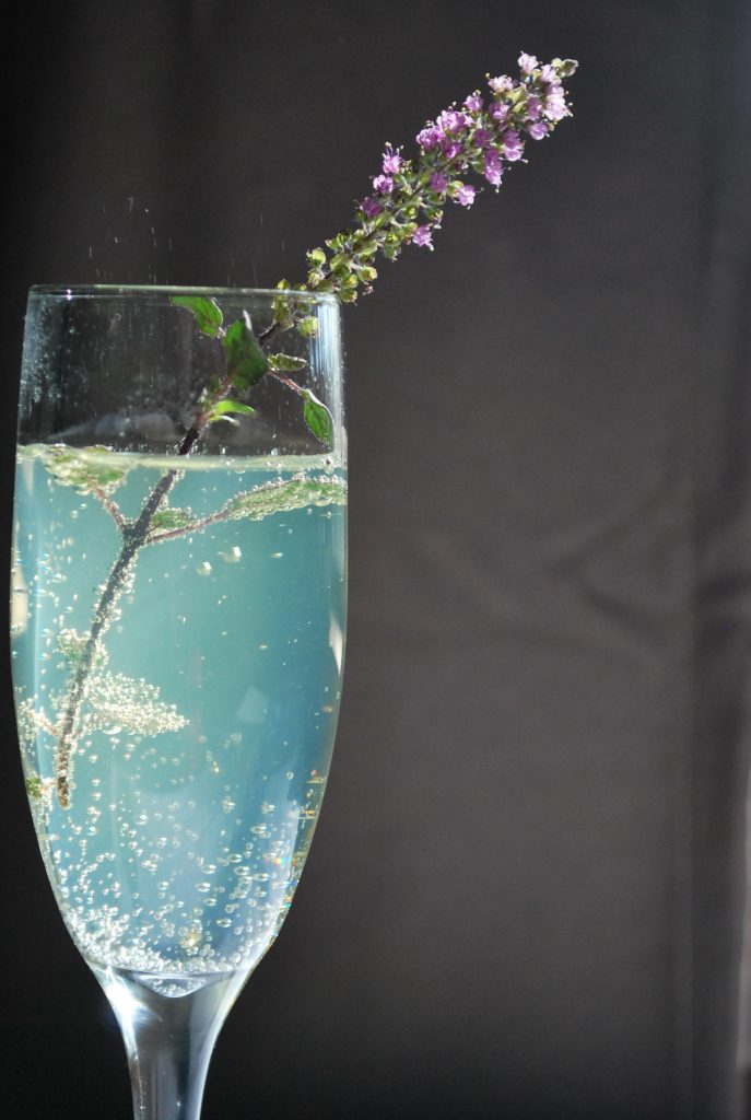 Herbal sparkling water in a fancy glass.